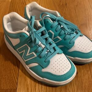 Great condition! Worn a few times. New Balance Kids' Teal and White Sneakers